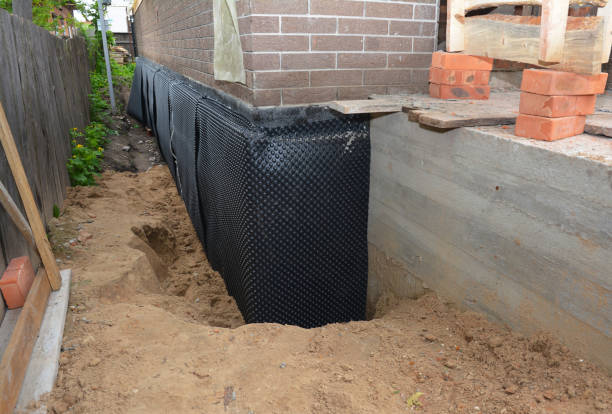 Happy homeowners after waterproofing job in Feasterville Trevose